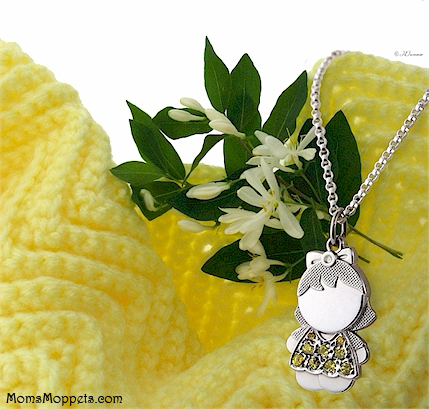 November girl with yellow stones and pendant chain.